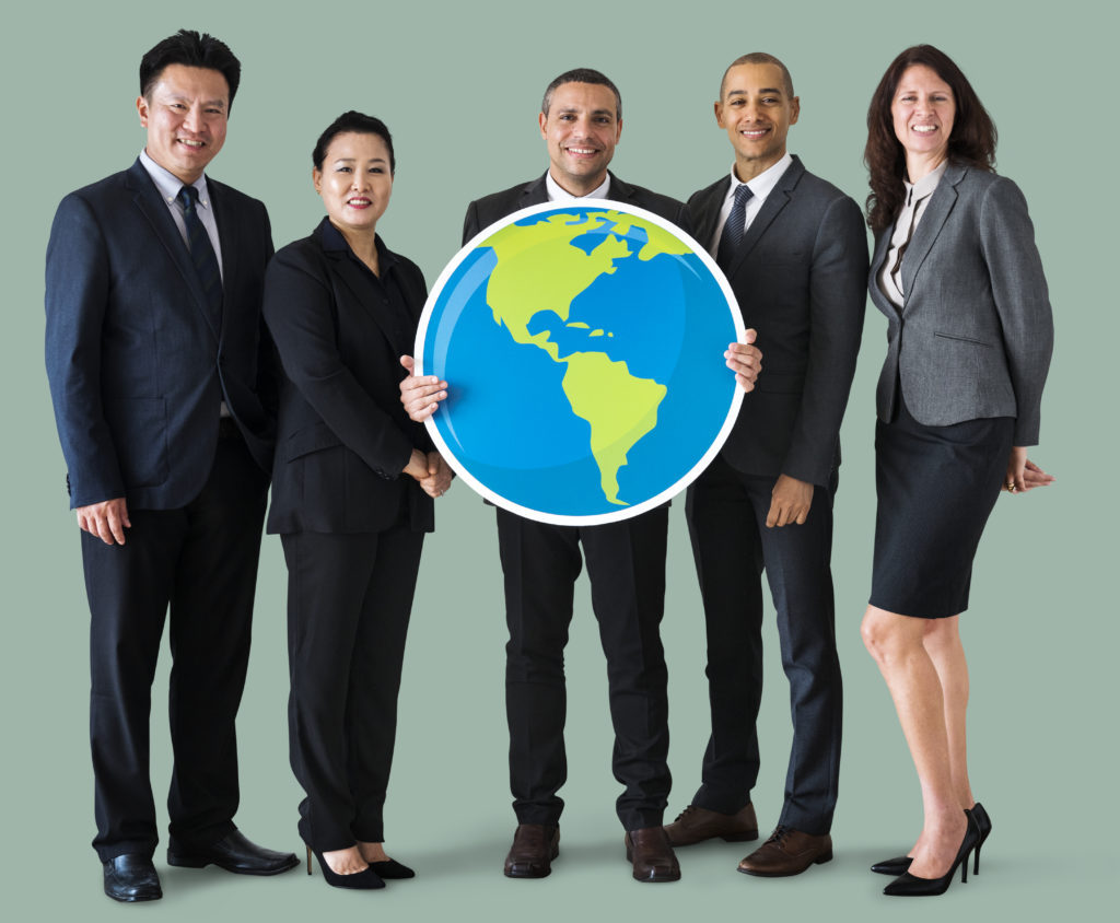 Business people standing and holding globe icon